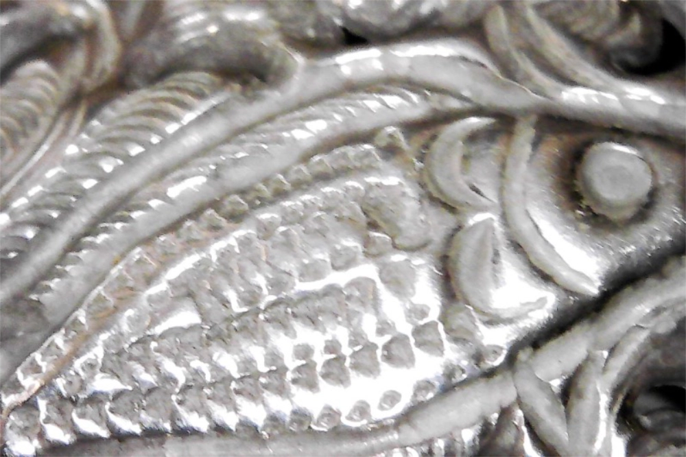 Closeup of fish engraved onto Vintage Antique Southeast Asian Silver Repoussé Cuff