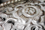 Closeup of flower engraved on Vintage Antique Southeast Asian Silver Repoussé Cuff