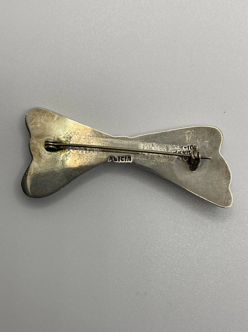 Back of the Authentic Vintage Alicia de la Paz Sterling Silver Bow Brooch with Alicia etched