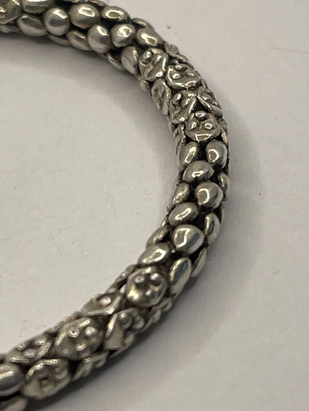 Closeup of side view of Balinese Popcorn Pebble Texture Silver Bracelet