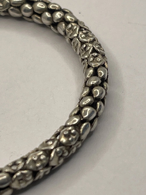 Closeup of side view of Balinese Popcorn Pebble Texture Silver Bracelet
