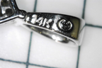Hallmark of the Preowned 14K White Gold Classic Square Cluster Diamond Pendant with 14K etched