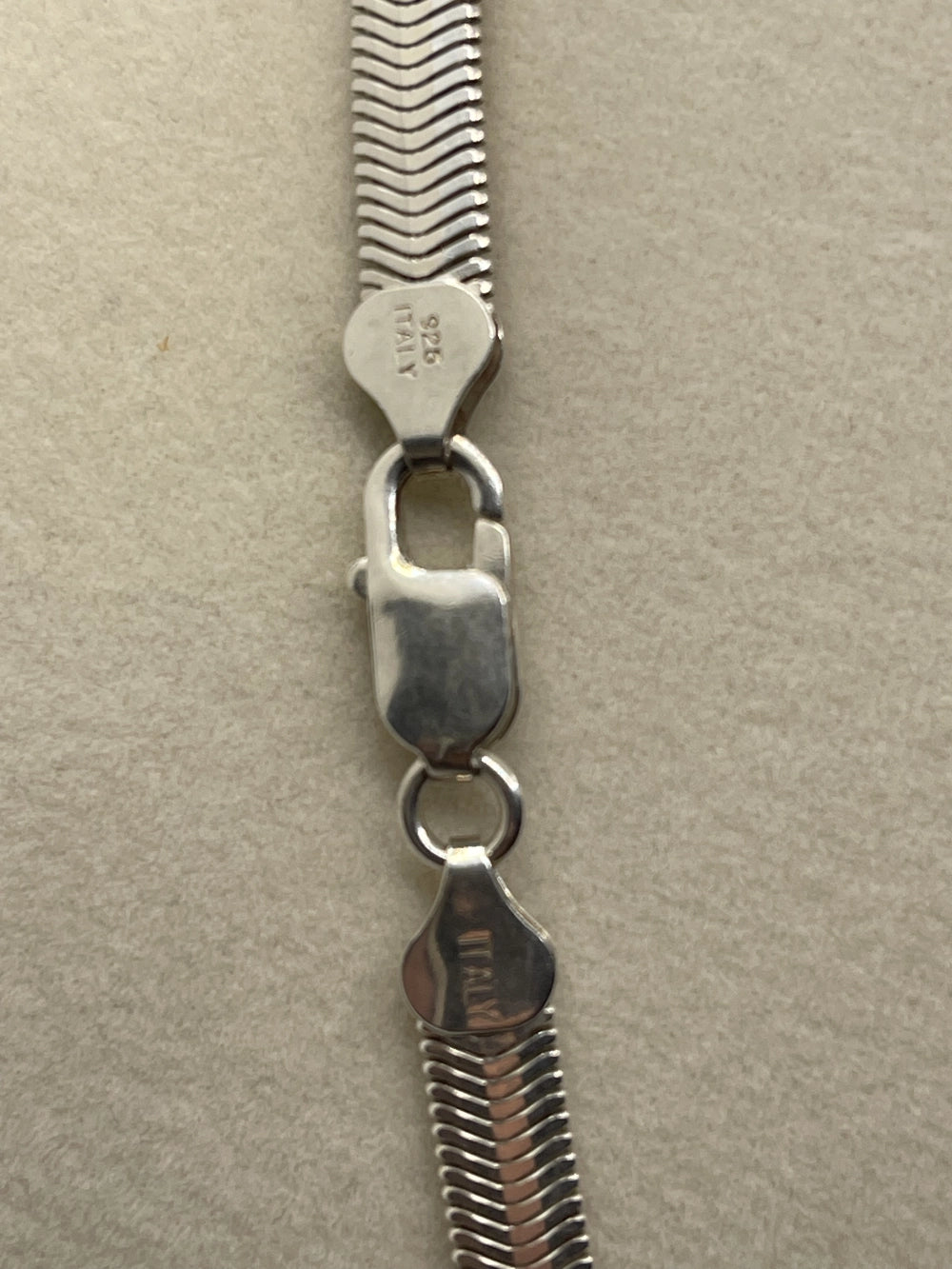 Closeup of the clasp of a Gently Preowned 925 Sterling Silver Flat Snake Herringbone Chain