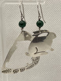 Front VIew of Preowned Sassi LaMuth Sterling Silver Rabbit Cut Out Earrings hanging on a rack