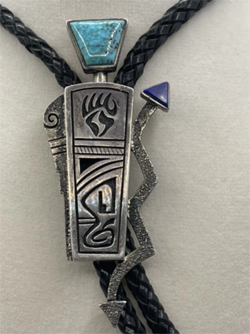 Closeup of the Signed Roy Talahaftewa Hopi Sterling Silver Overlay Bolo Tie