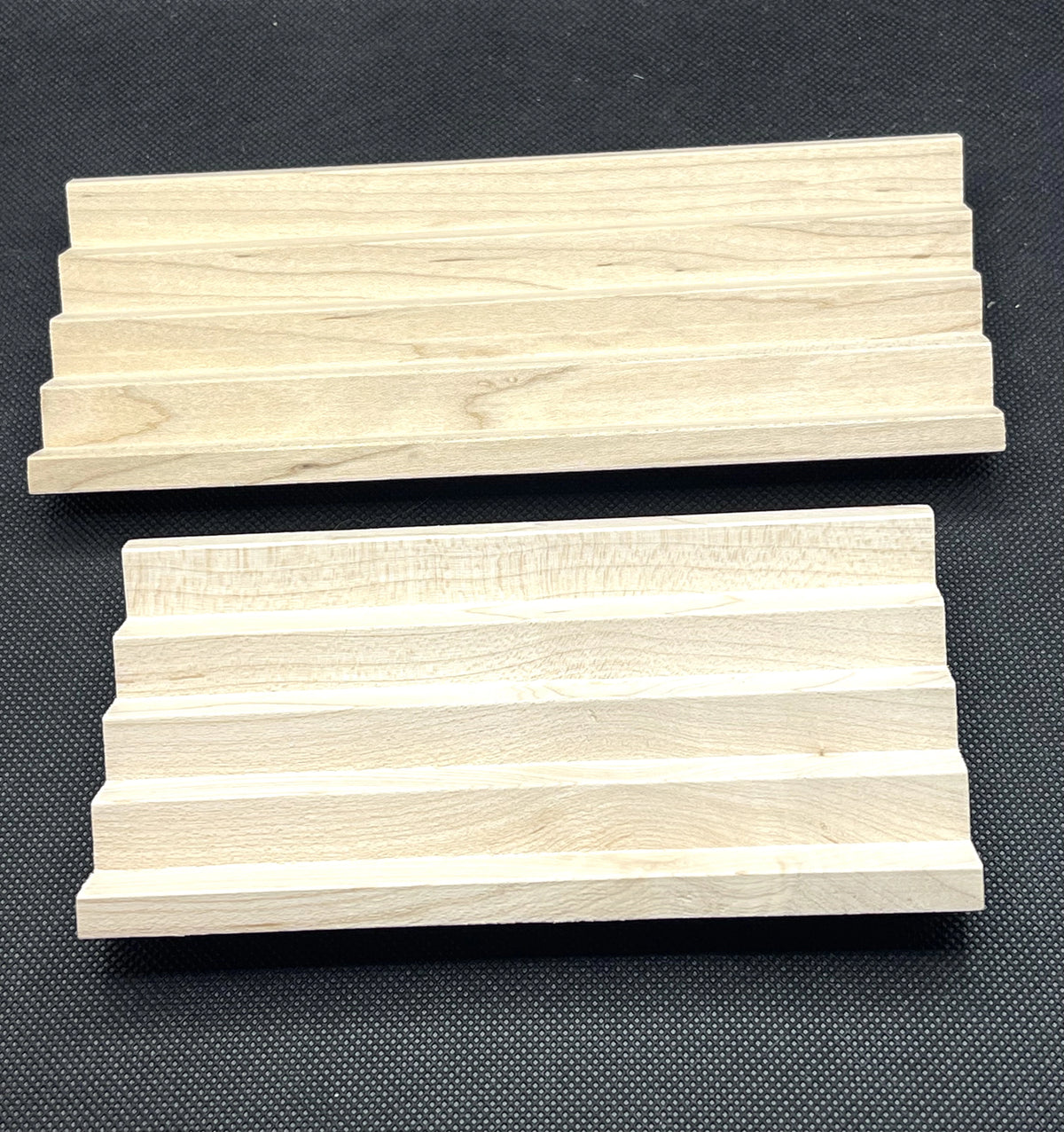 Two maple chevron hardwood soap racks side by side