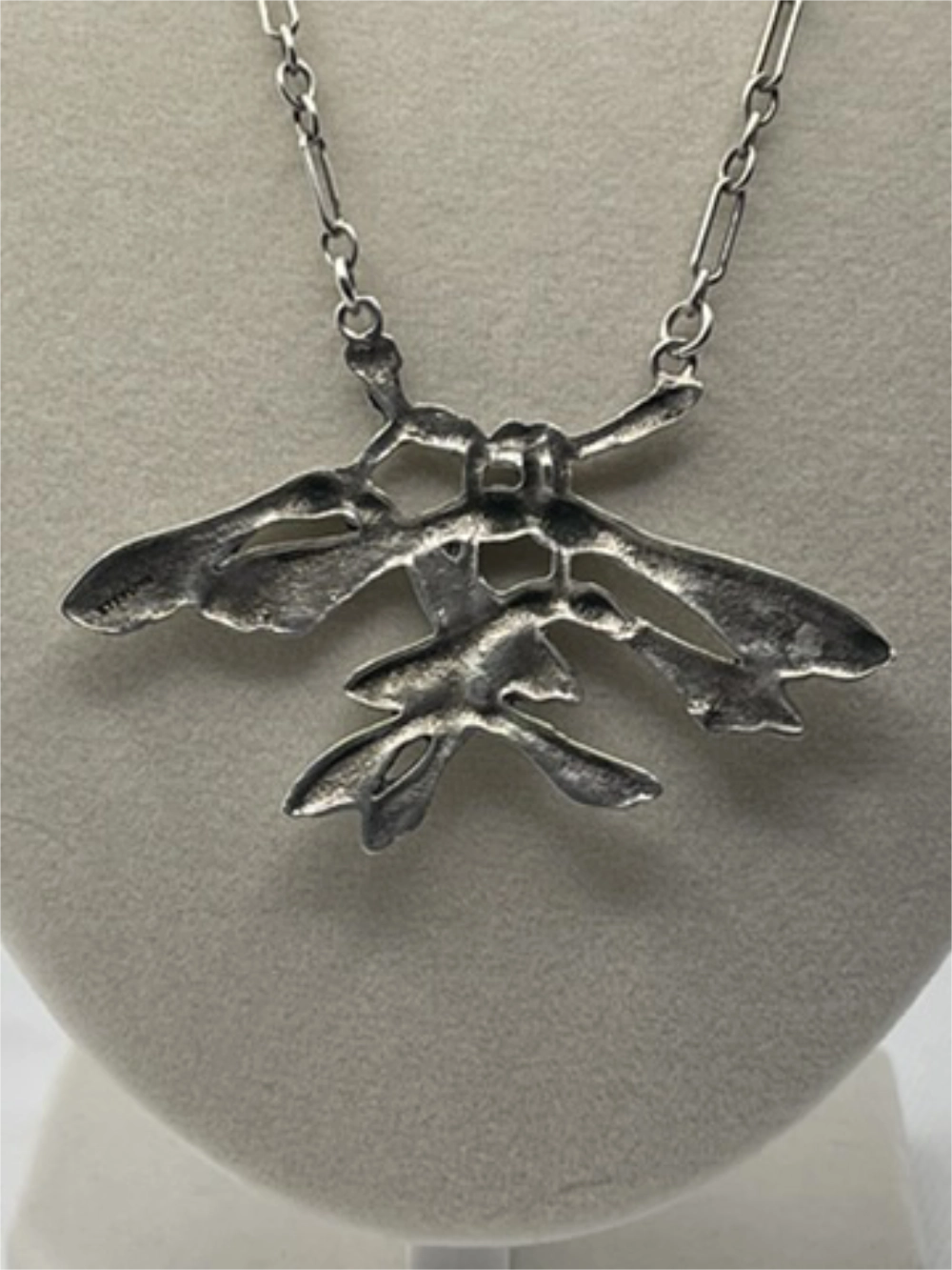 Insect shaped pendant on the Vintage Mid-Century Sterling Sycamore Helicopter Seed Necklace