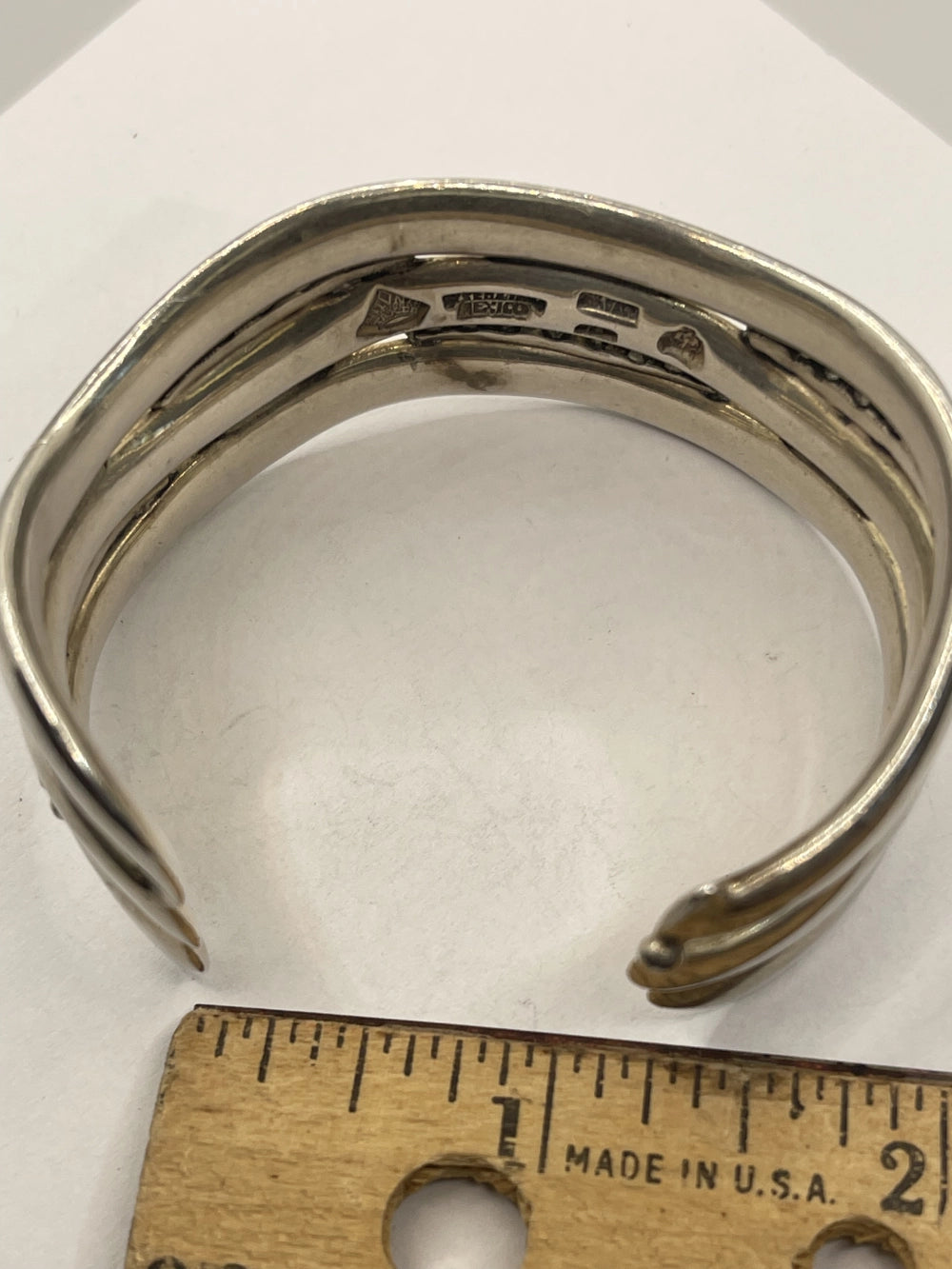 Side VIew of Vintage Anthony Pineda 970 Sterling Silver Modernist Cuff Bracelet next to a ruler