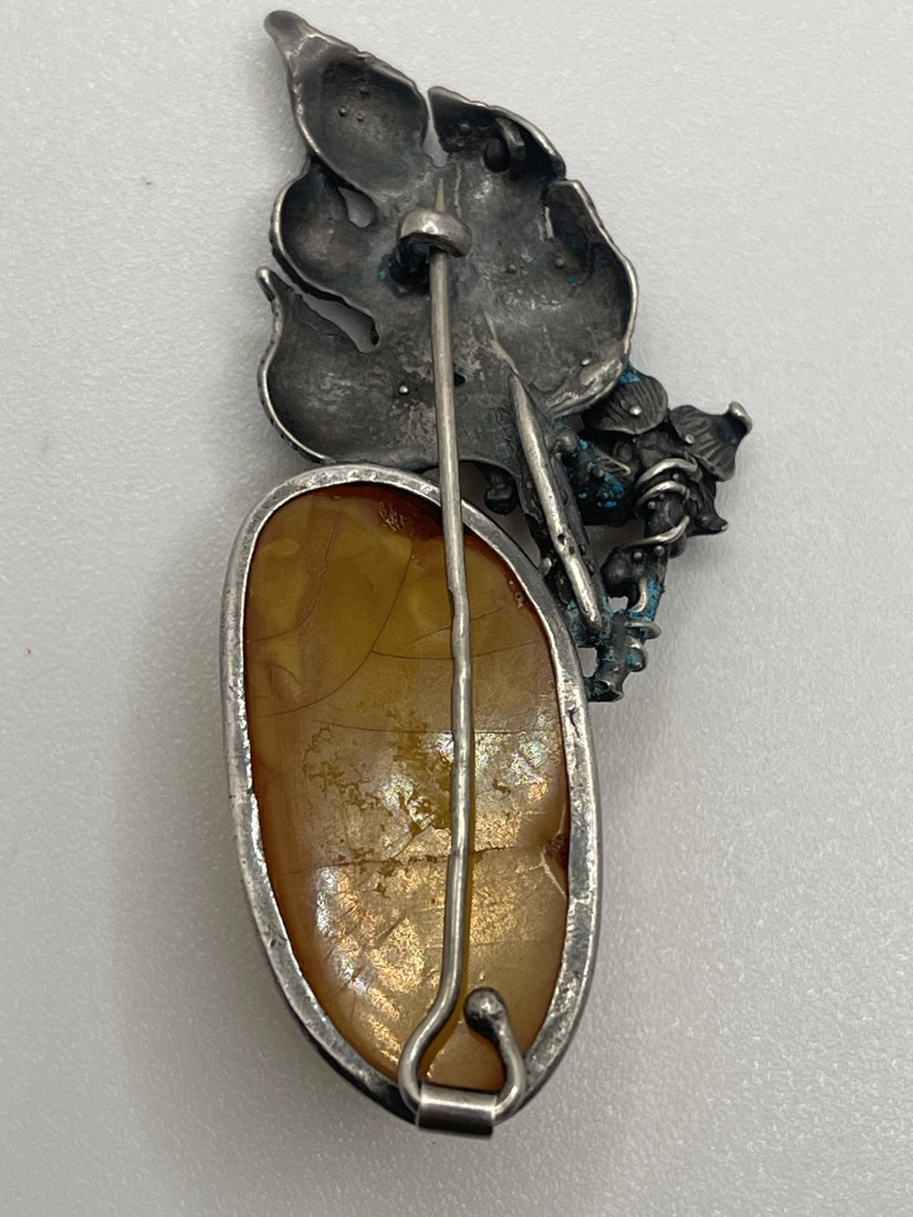 Back of the Vintage Baltic Honey Amber Silver Floral Brooch