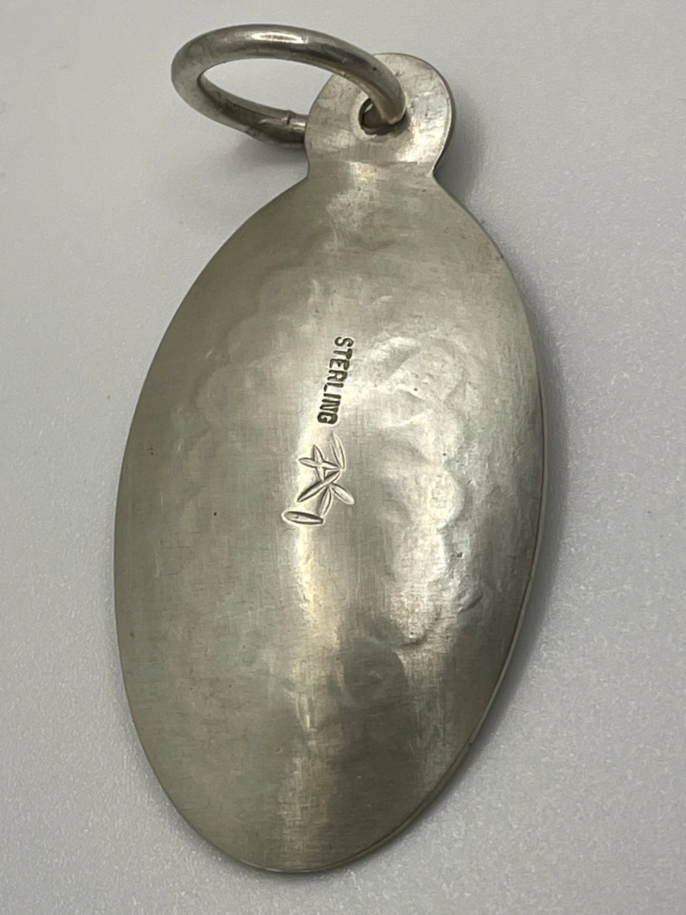 Back view of the Vintage Bishana Oval Sunburst Sterling Silver Pendant with Sterling etched