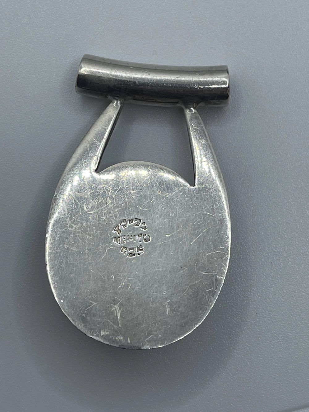 Back of the Vintage Taxco Mexico Black Onyx Silver Horseshoe Pendant with 19-75 Mexico 925 etched