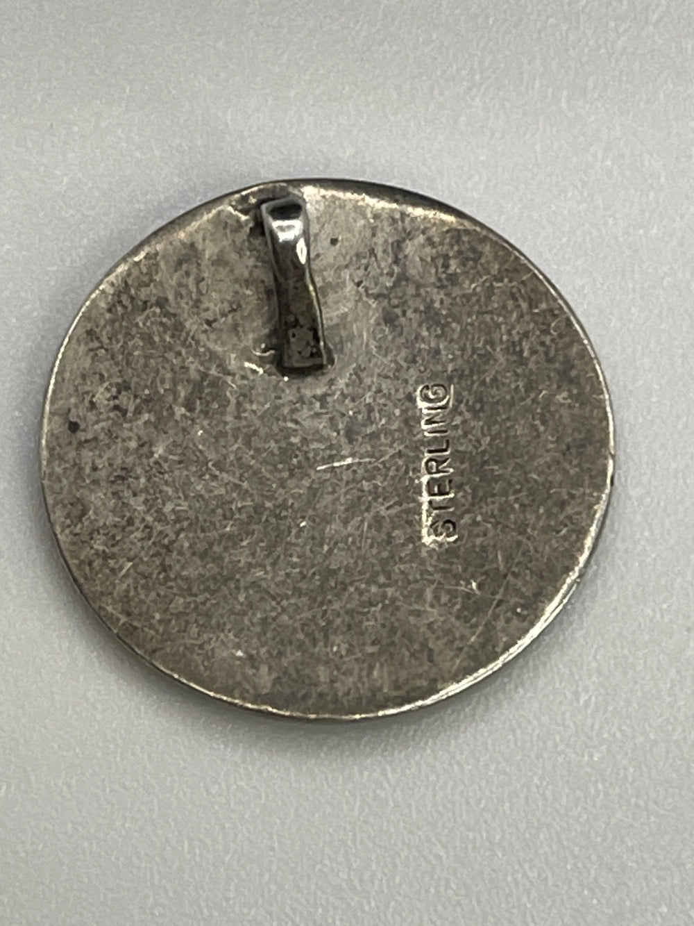Back of the Vintage Celestial Sun Moon Abalone Pendant with Sterling etched