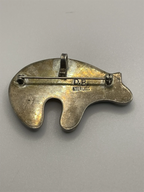 Back and Hallmark view of the Vintage David Begay Dual Function Pendant and Brooch with D.B. Sterling etched