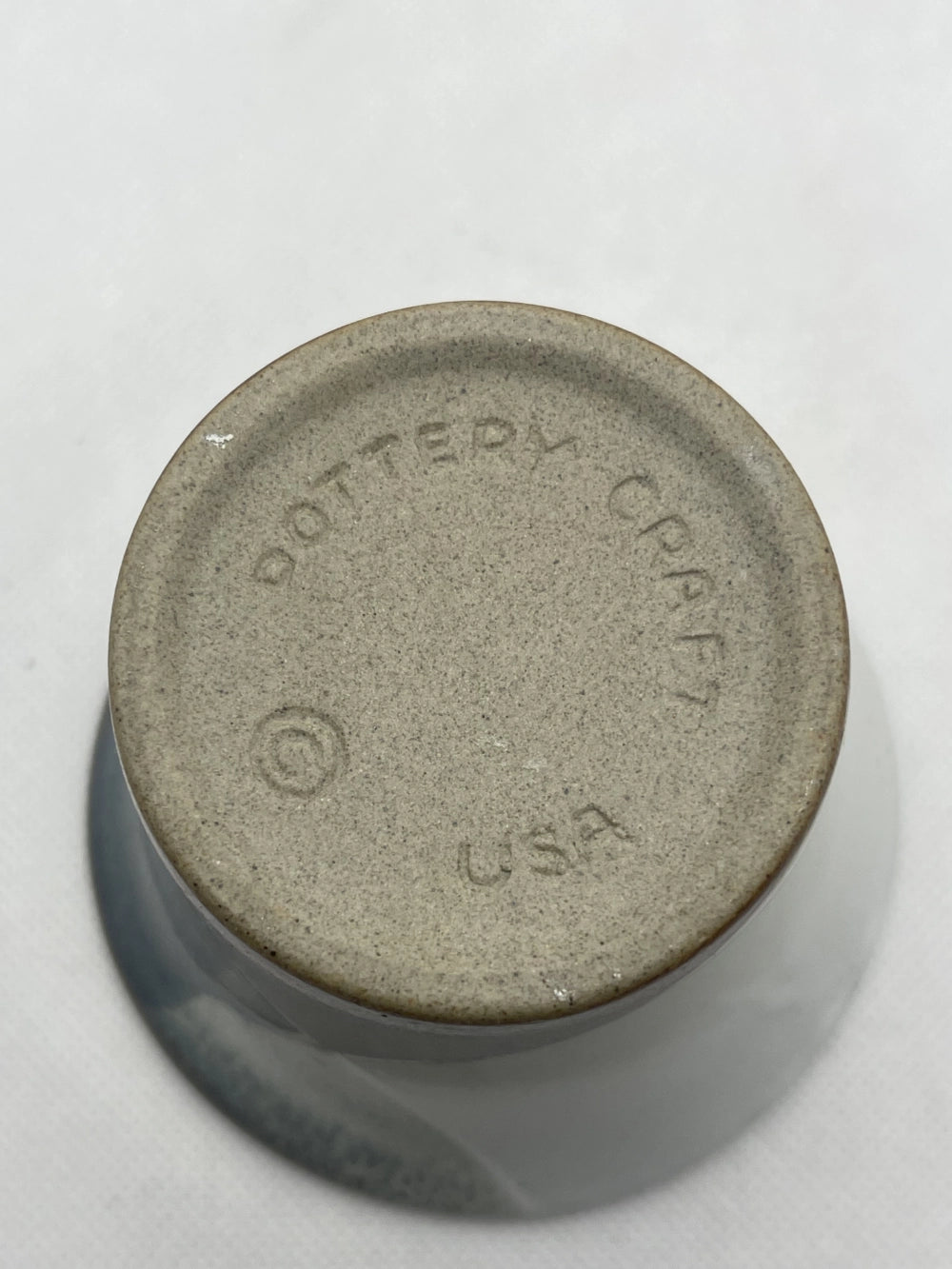 Bottom of Vintage Pottery Craft USA Vino Cup Vase with Dottery Craft Copyright USA etched on it