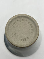 Bottom of Vintage Pottery Craft USA Vino Cup Vase with Dottery Craft Copyright USA etched on it