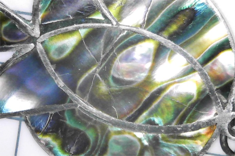 Closeup of Vintage Rafael Melendez Taxco Silver Abalone Screwback Earrings
