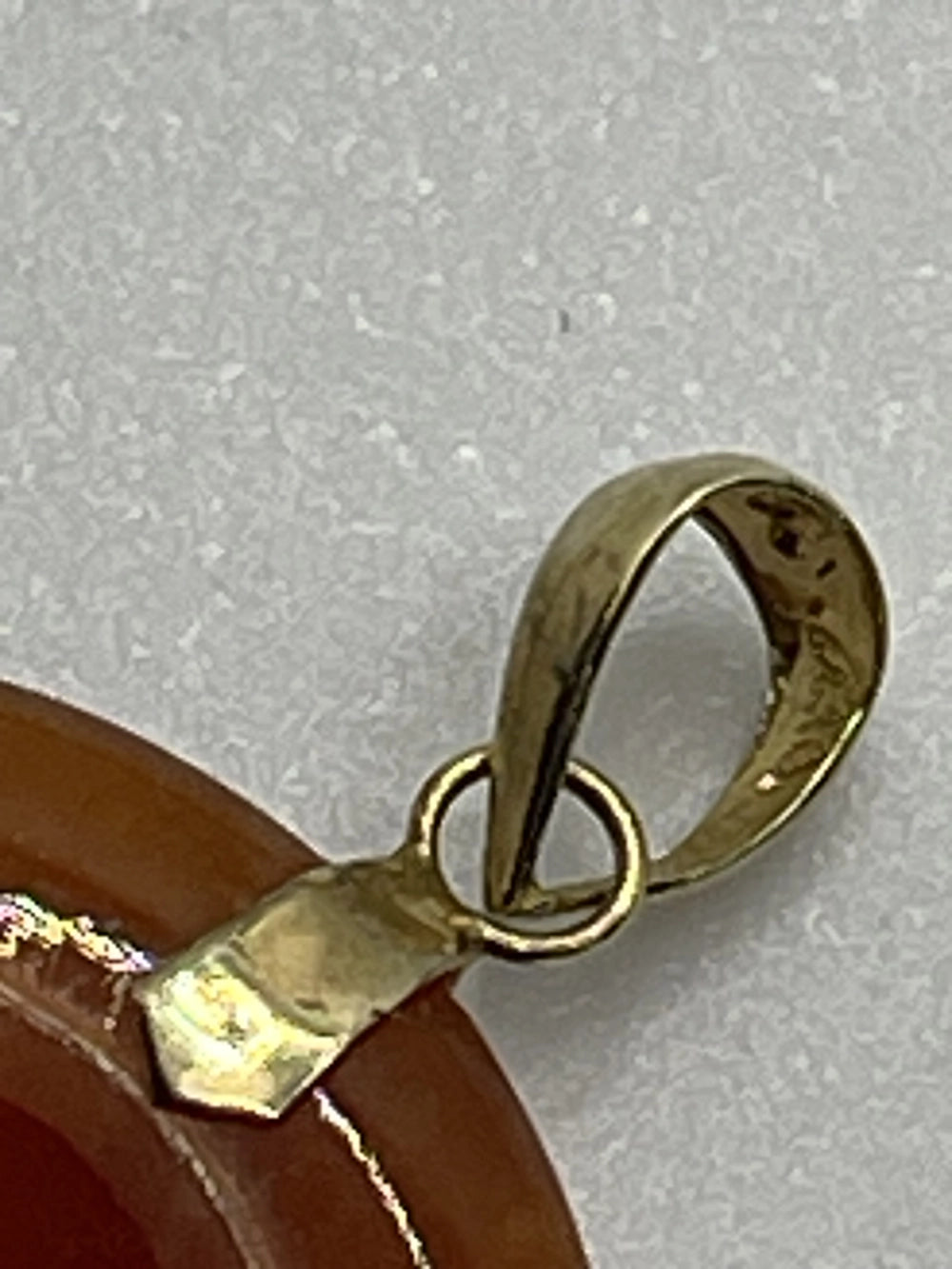 Closeup of the back of Vintage Red Carnelian 14k Gold Chinese Good Luck Pendant