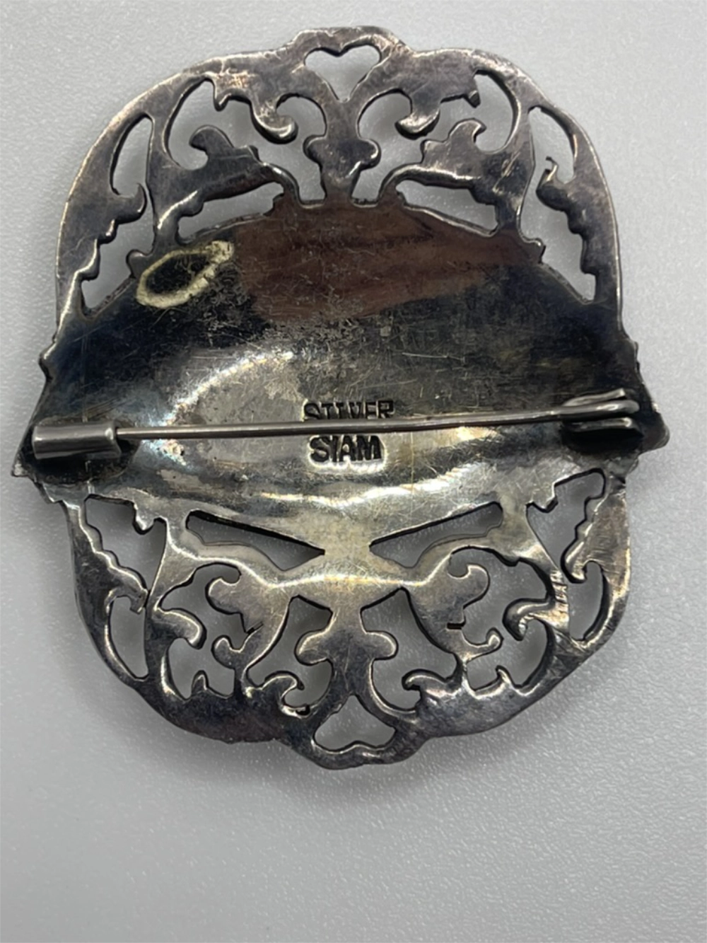 Back of the Vintage Siam Sterling Silver Niello Fan Shaped Brooch with Silver Siam etched