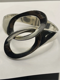Closeup of links of Vintage Genuine Alicia de la Paz Modernist Interlocking Silver Bangle Bracelet