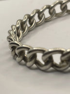 Closeup of Vintage Sterling Silver Rigid Curb Chain Bangle Bracelet