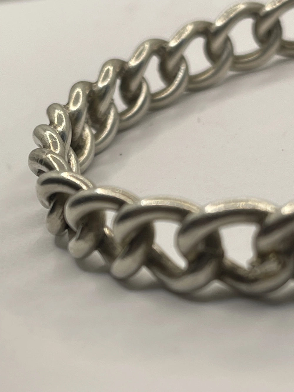 Closeup of Vintage Sterling Silver Rigid Curb Chain Bangle Bracelet