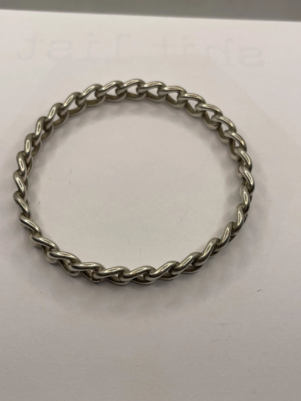 Overheard view of Vintage Sterling Silver Rigid Curb Chain Bangle Bracelet