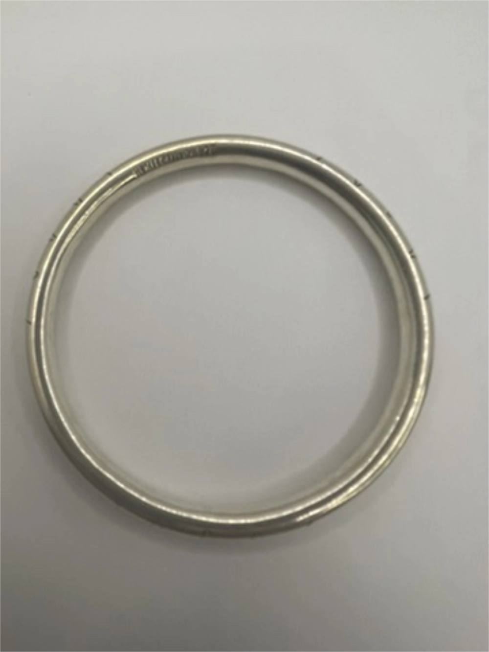 Overhead view of Vintage Hand-Etched Taxco Mexico Sterling Silver Bangle Bracelet