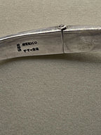 Close-up of a silver folding knife from the Vintage Taxco Mexico Silver Modernist Collar Choker