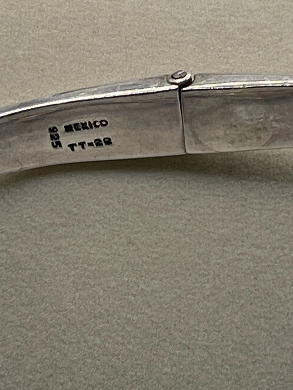 Close-up of a silver folding knife from the Vintage Taxco Mexico Silver Modernist Collar Choker