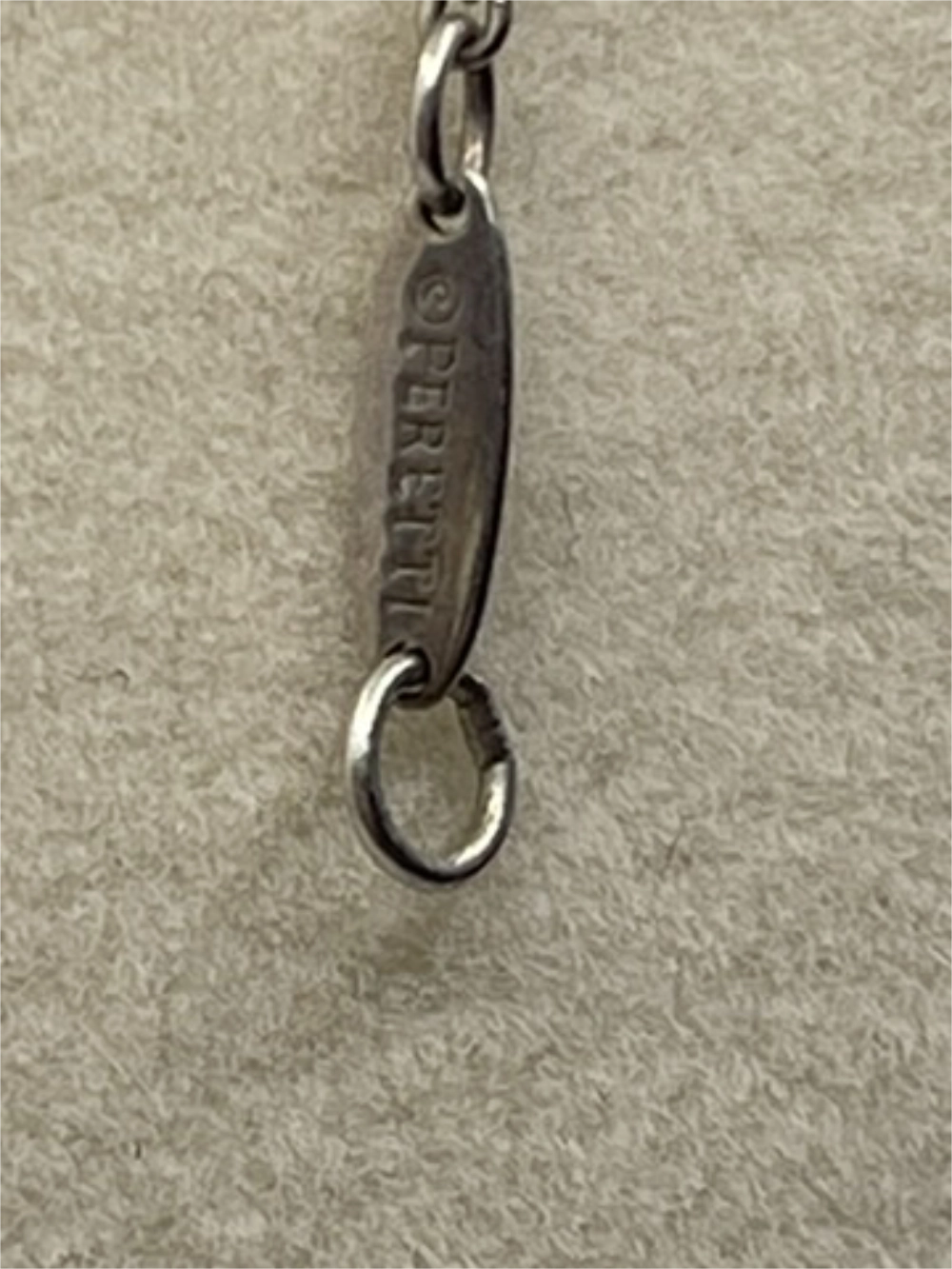 Sliver Clasp of a Vintage Tiffany & Co. Elsa Peretti Pearl Mesh Tassel Pendant Necklace